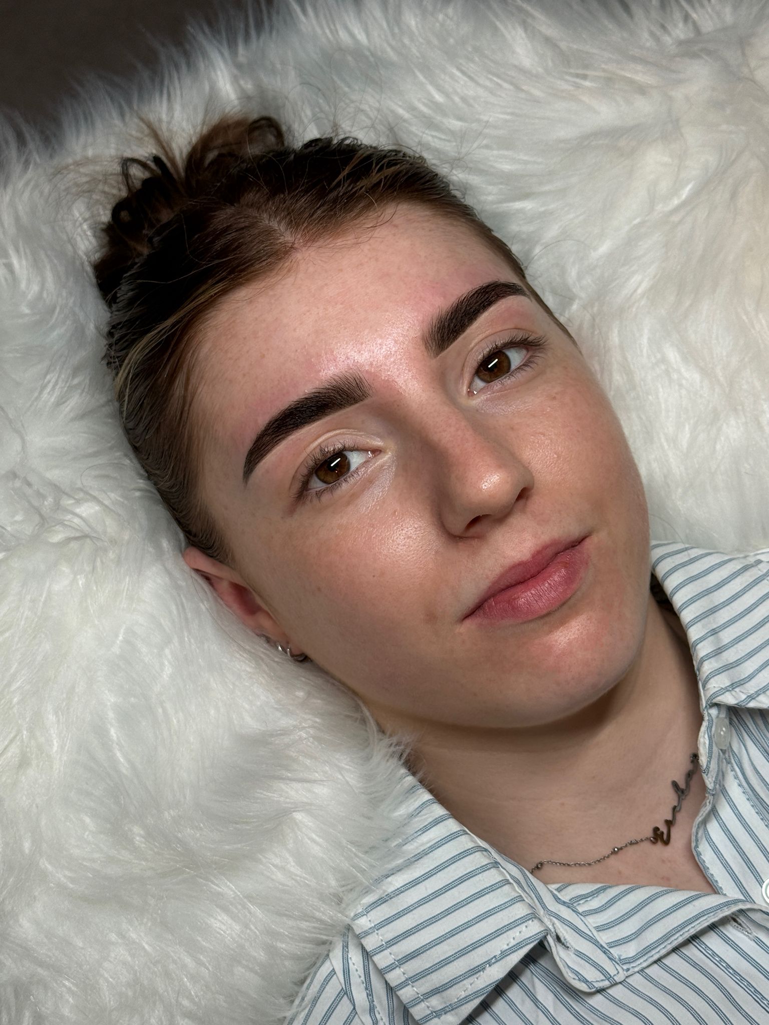 Client brow result with hair tied up